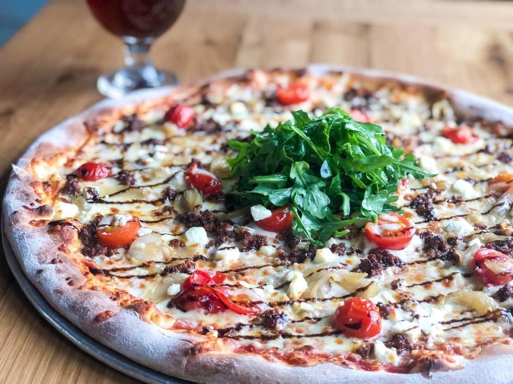 Savor wood-fired pizzas, enjoy casual dining with fresh ingredients.