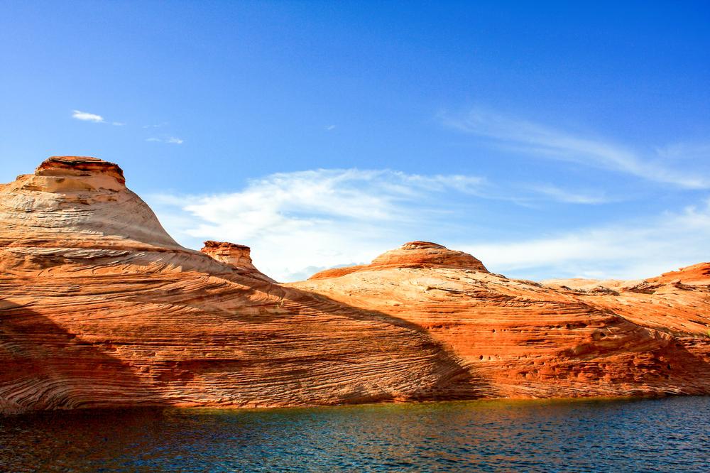 Paddle red rock canyons and explore coves during an unforgettable summer trip.