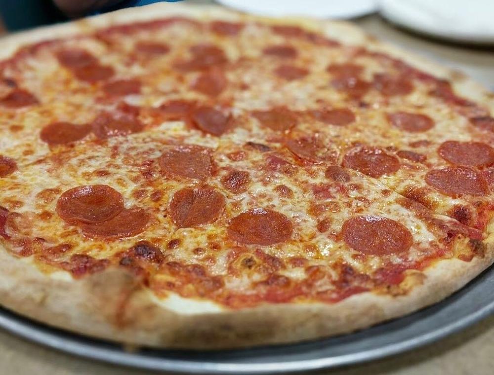 Savor a Classic Slice at Sam’s Pizza Palace