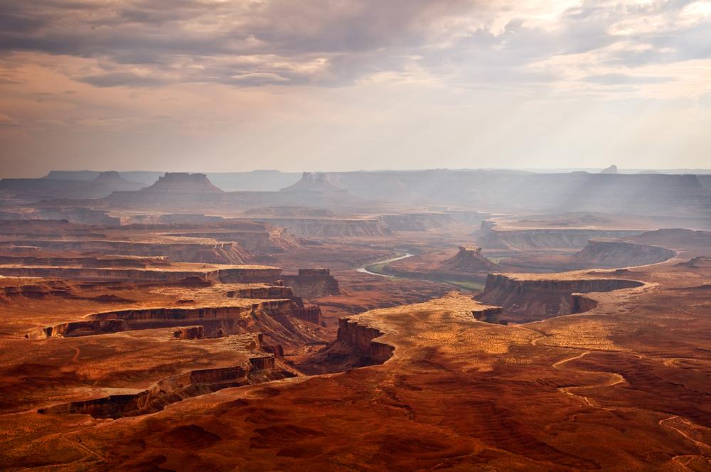Admire dramatic cliffs and go hiking through vast red rock sights.