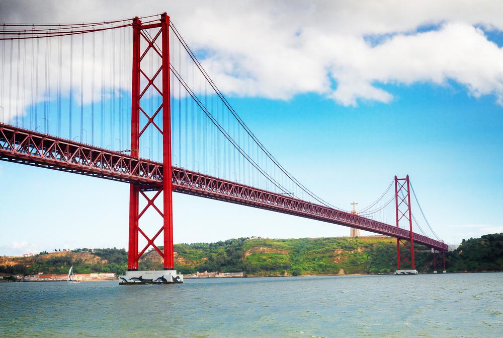 Marvel at the Golden Grandeur of the 25 de Abril Bridge