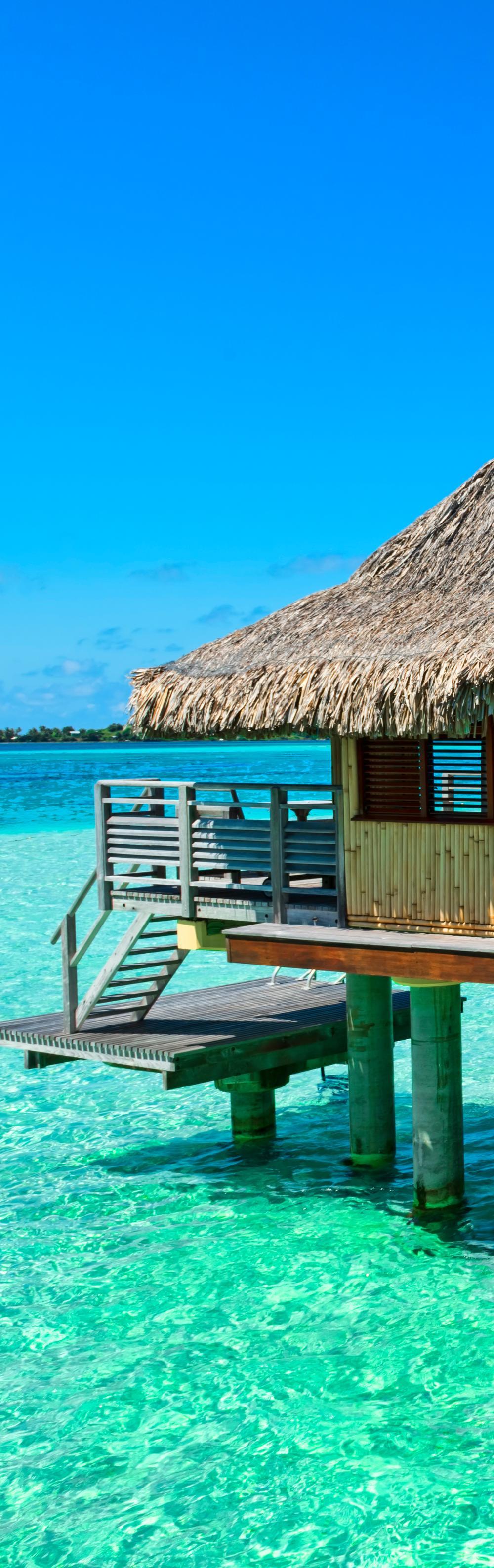 Volcanic peaks, private villas, and glowing blue lagoons make this French Polynesian icon pure magic.