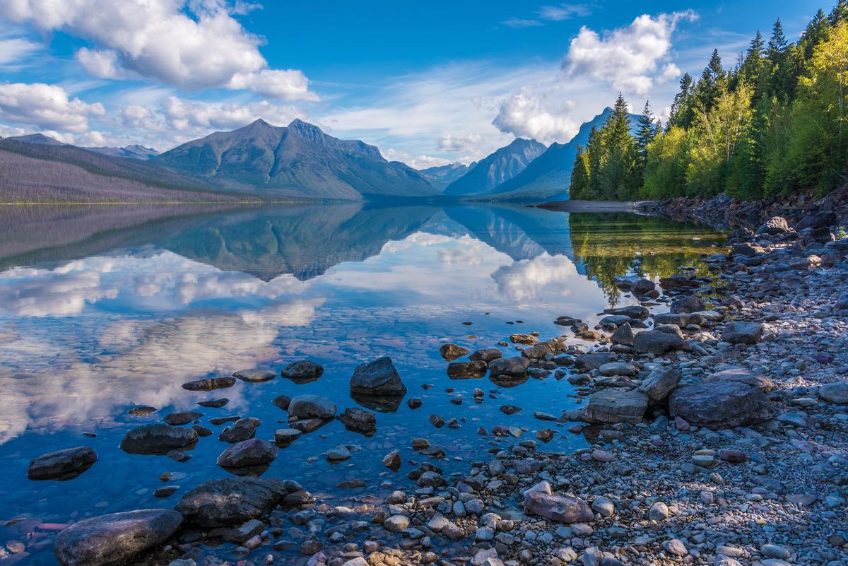 Admire mirrored waters or walk along peaceful shores on a fall trip.