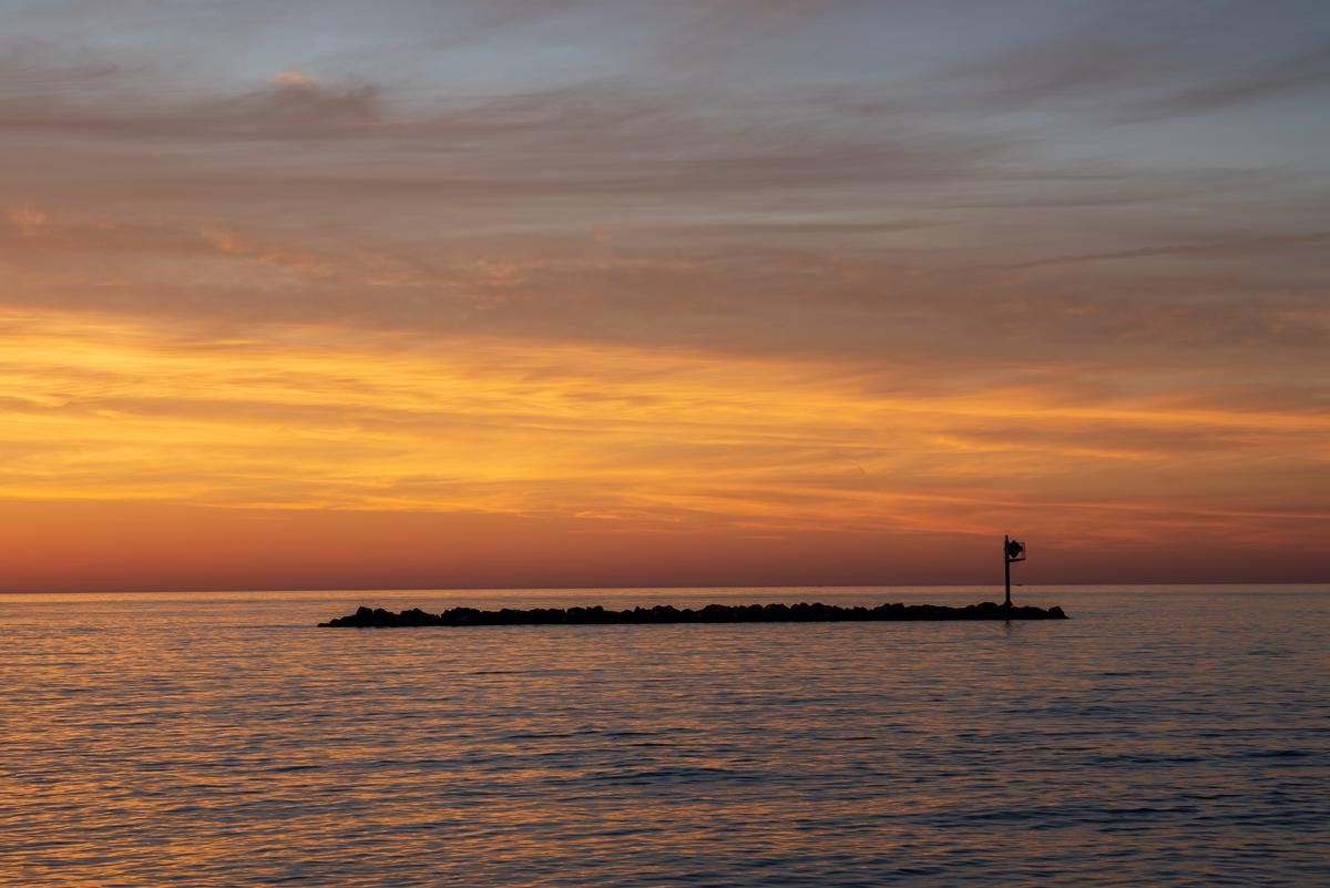 Lake Erie at dawn from East Harbor State Park. Rock jetty protecting a beach in Ohio near Sandusky.