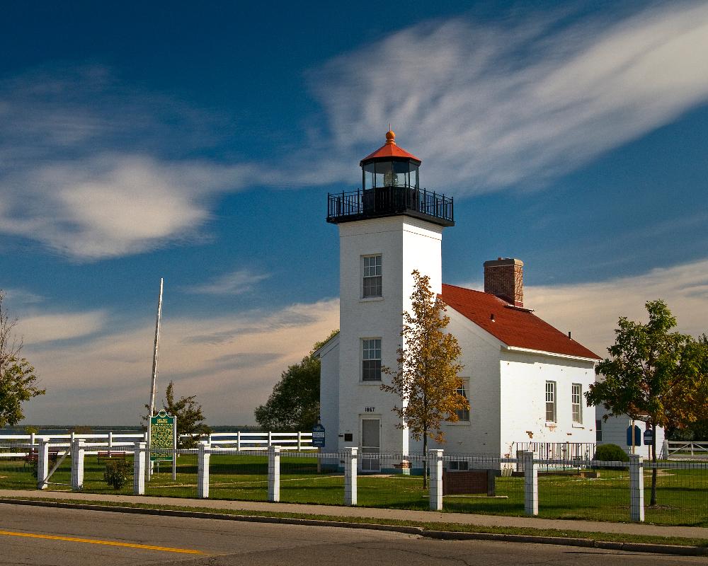 Admiring the Sand Point lighthouse on Lake Michigan