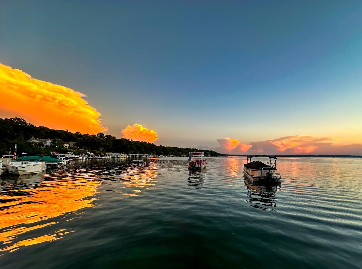 A beautiful sunset on Lake Geneva, WI with boats
