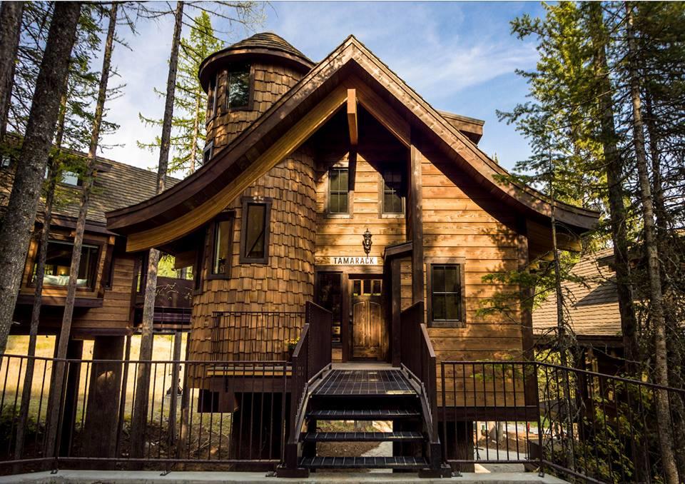 Stay in magical mountaintop treehouses that redefine romance under Montana snow.