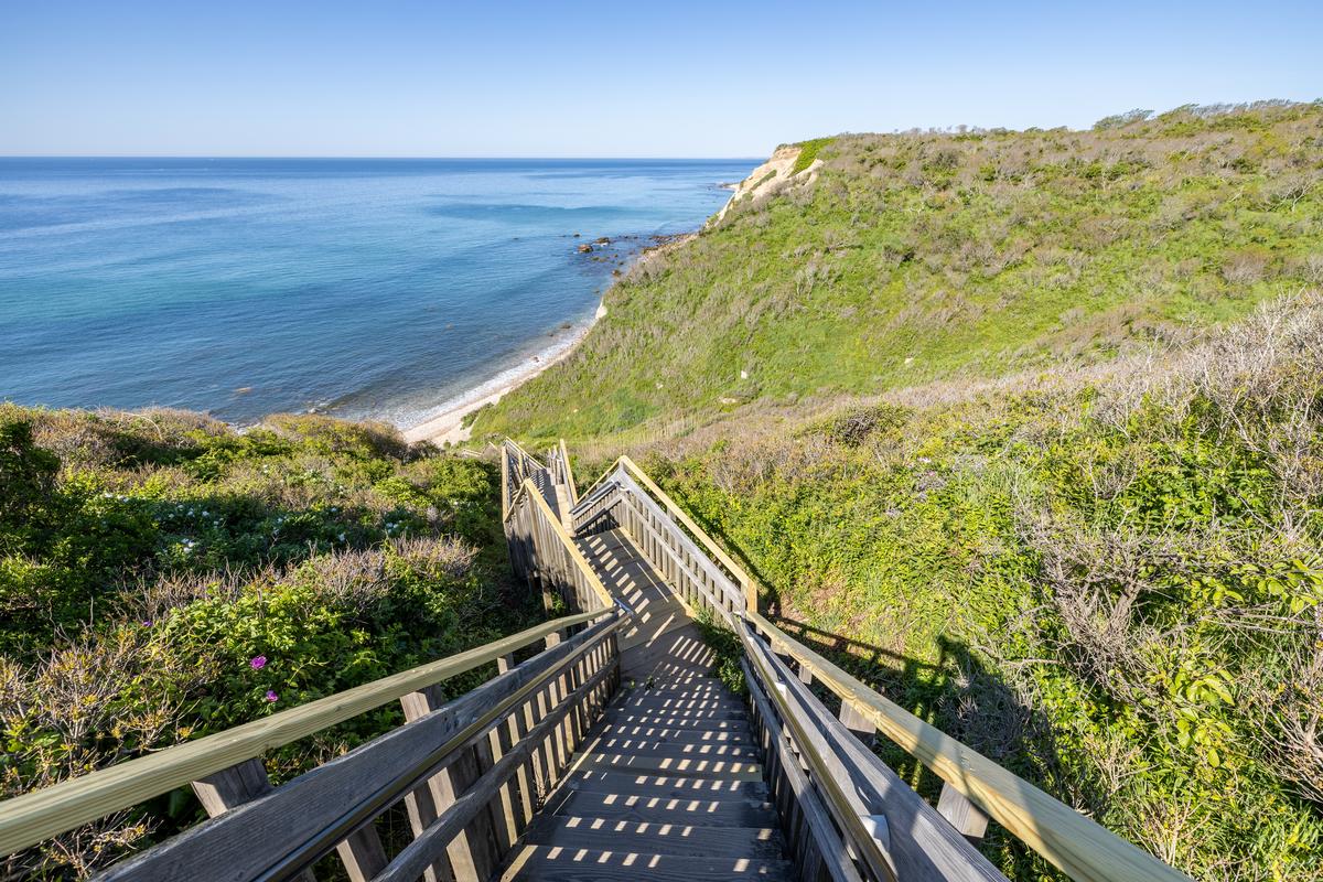 Long wooden staircase leading down to the beach at Mohegan Bluffs, Block Island
