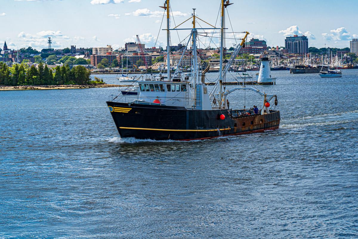 A fishing boat leaving New Bedford harbor