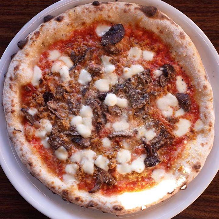 Bite into wood-fired pizzas and enjoy an affordable Neapolitan-style meal.