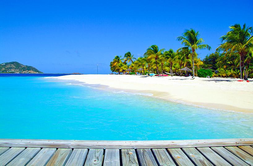Relax on White Sands at Palm Island Resort in the Grenadines