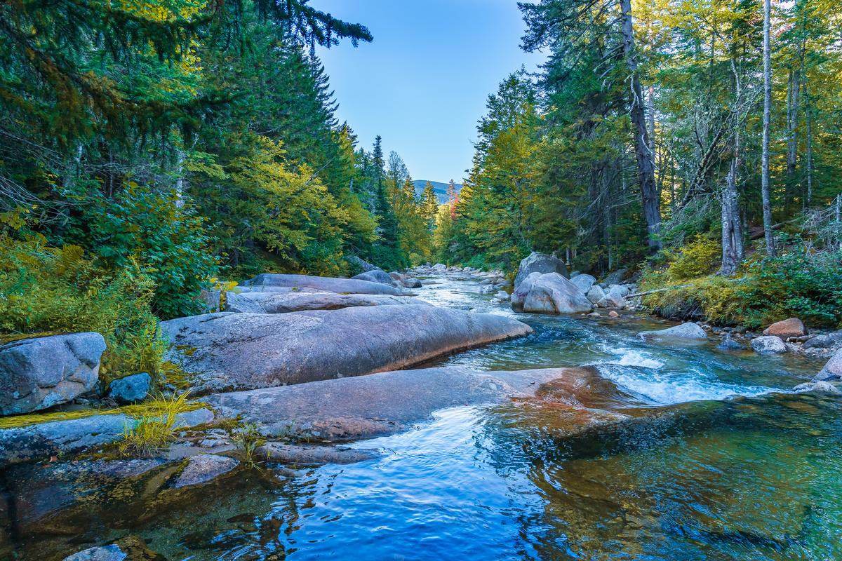 Huge smooth boulders near a waterfall in the foothills of Mount Washington in the White Mountain National Forest