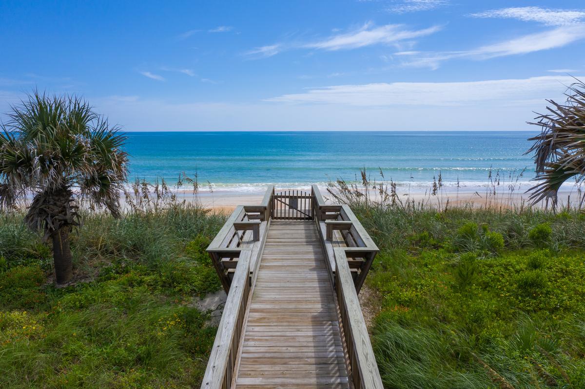 Walking across the boardwalk to Hammock Beach, Florida