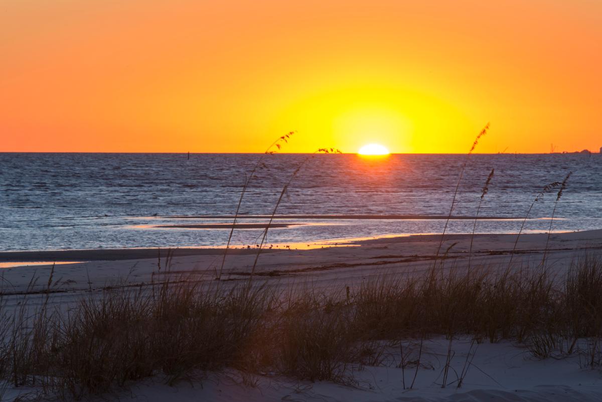 Orange sunset on the beach in Bay St. Louis