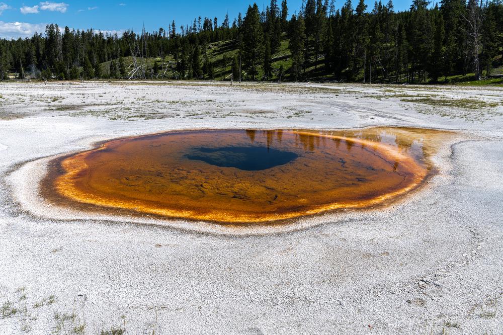 The vivid colors of its basin and runoff channels are created by microscopic lifeforms